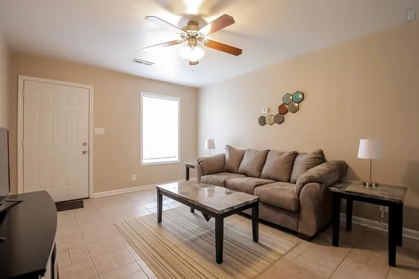 a living room with furniture and a window