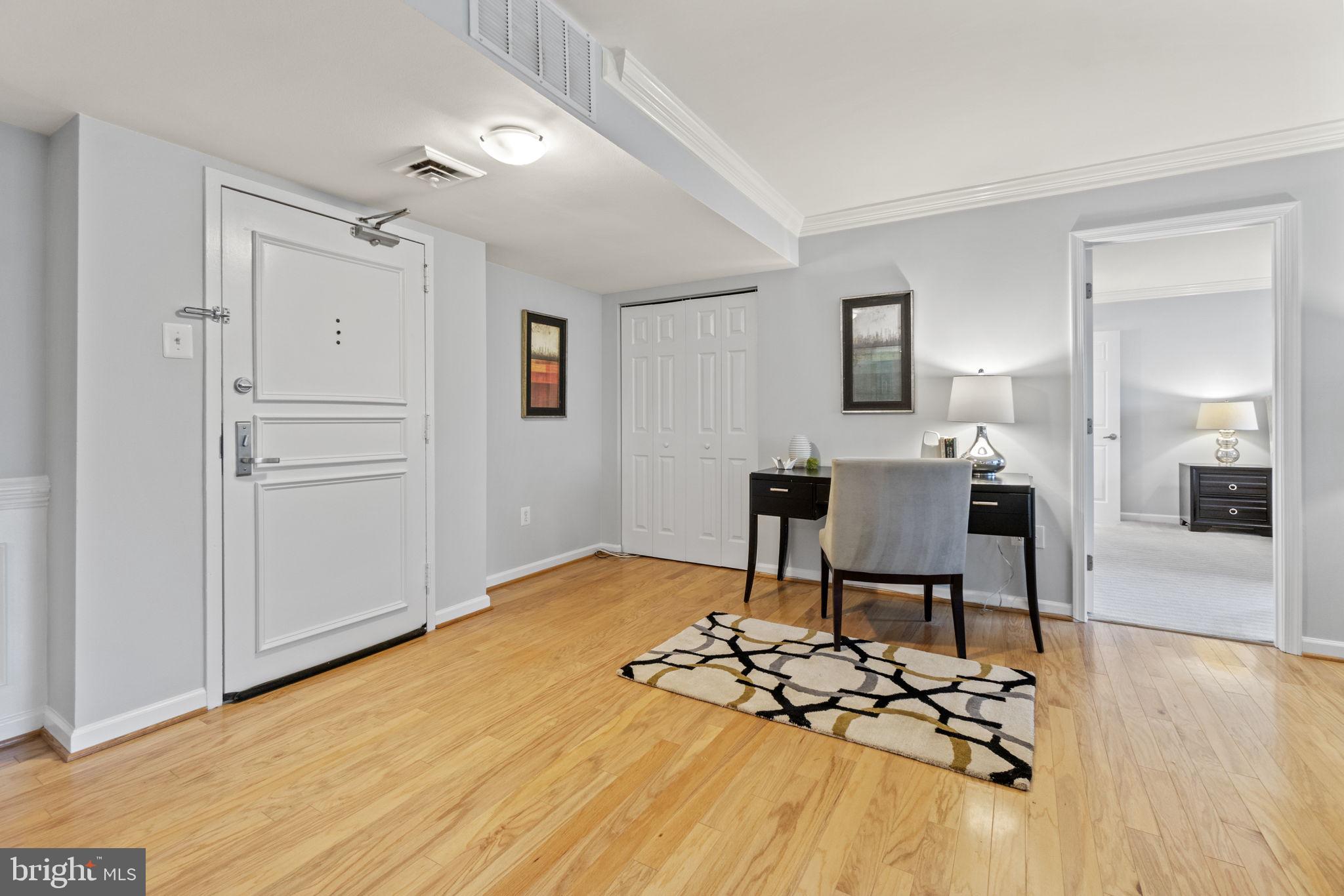 1515 South Arlington Ridge Road, Unit 603 Arlington, VA 22202 - Photo 8 of 22 a view of a workspace with furniture and wooden floor