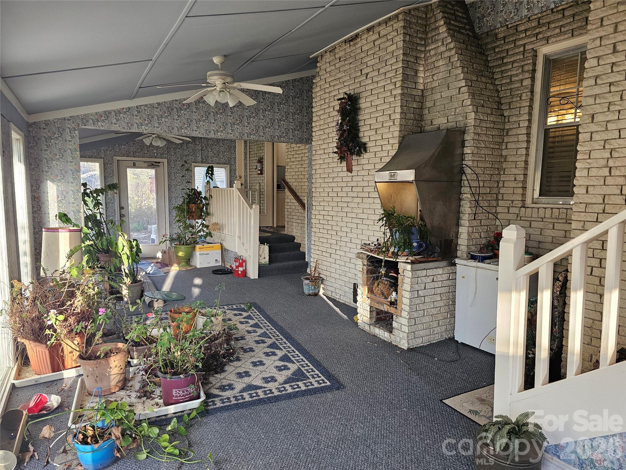 979 Suttle Road Lancaster, SC 29720 - Photo 15 of 26 a view of a porch with chairs and potted plants