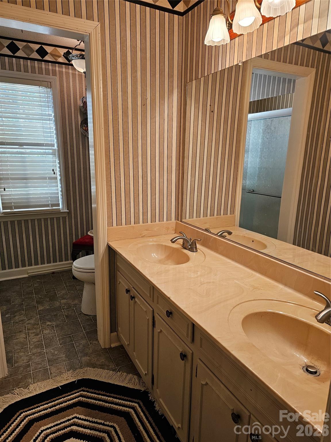 979 Suttle Road Lancaster, SC 29720 - Photo 16 of 26 a bathroom with a sink and a mirror
