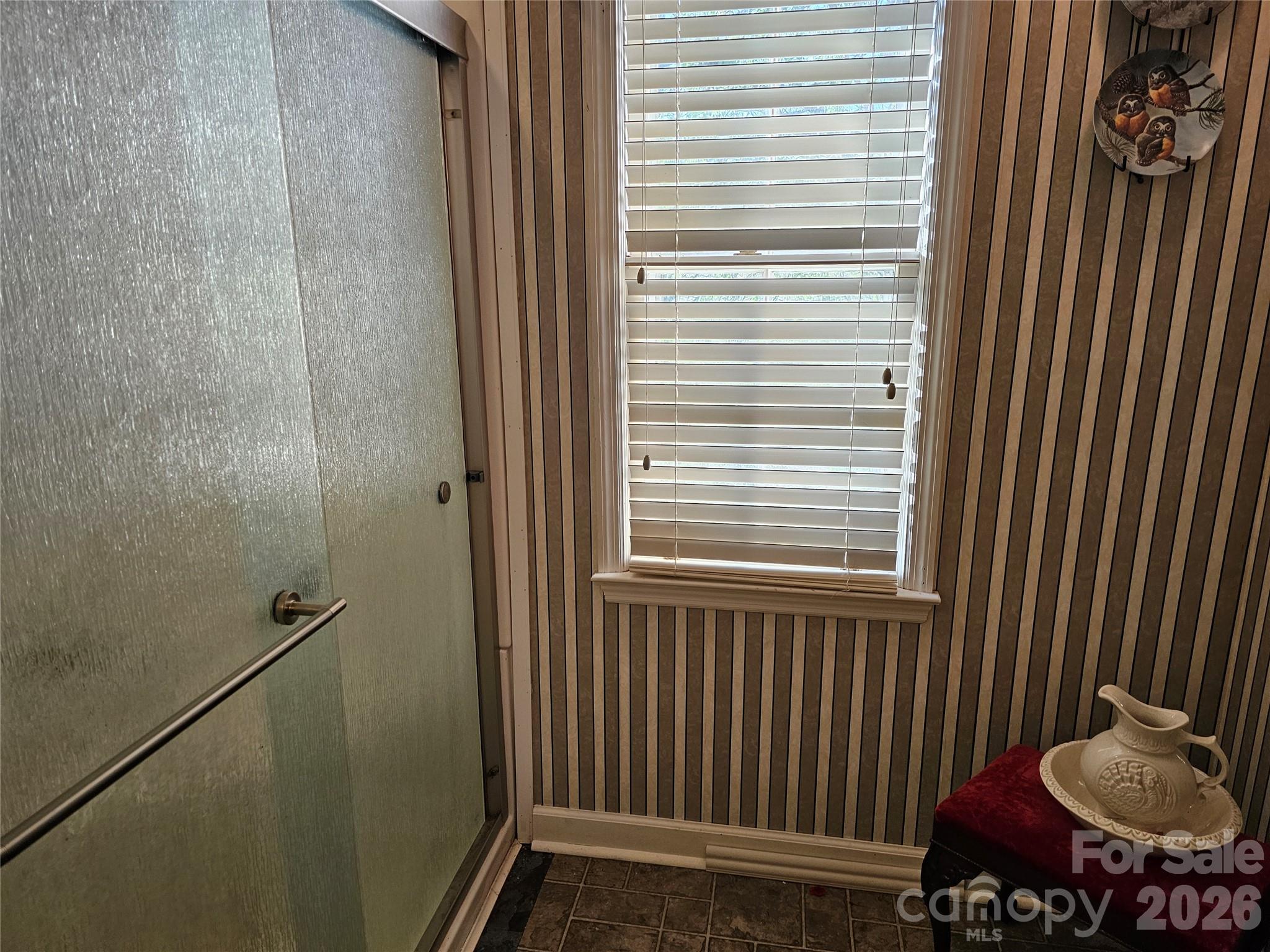 979 Suttle Road Lancaster, SC 29720 - Photo 17 of 26 a bathroom with a window and a shower