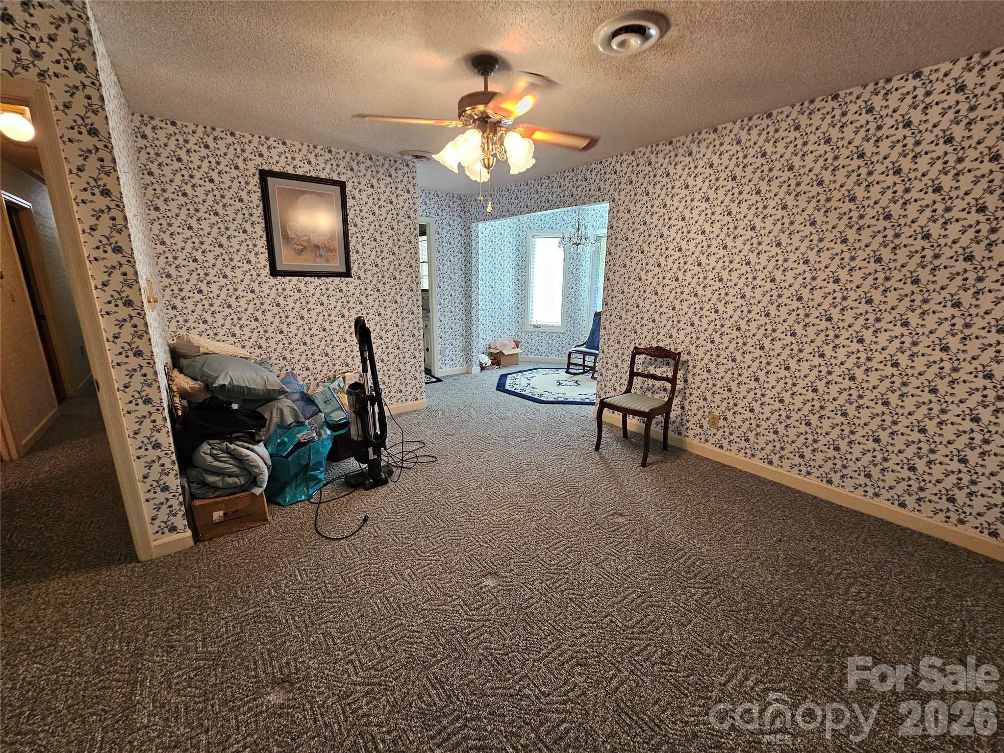 979 Suttle Road Lancaster, SC 29720 - Photo 21 of 26 a view of a livingroom with furniture and a ceiling fan