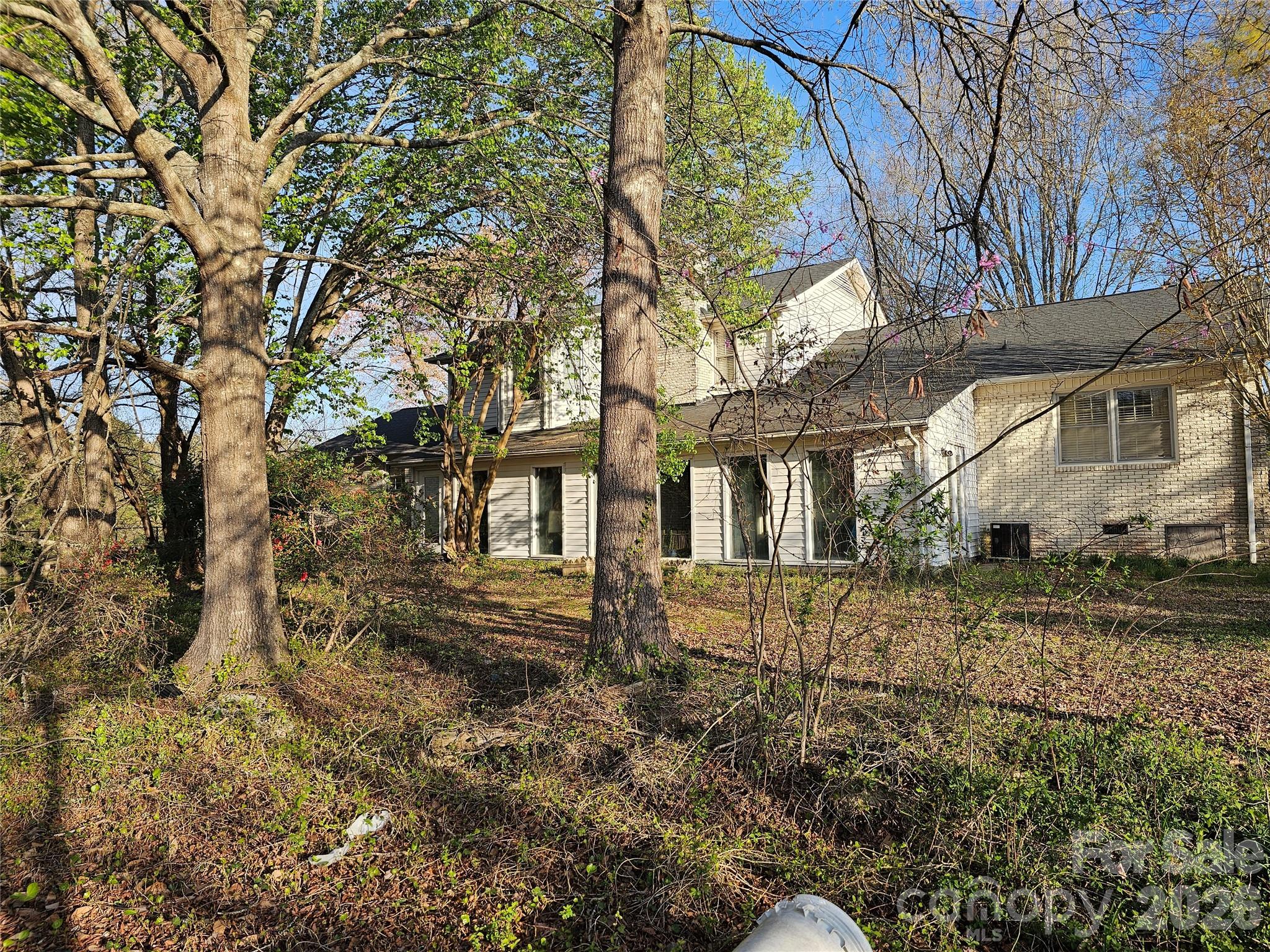 979 Suttle Road Lancaster, SC 29720 - Photo 25 of 26 a view of a large white house next to a yard