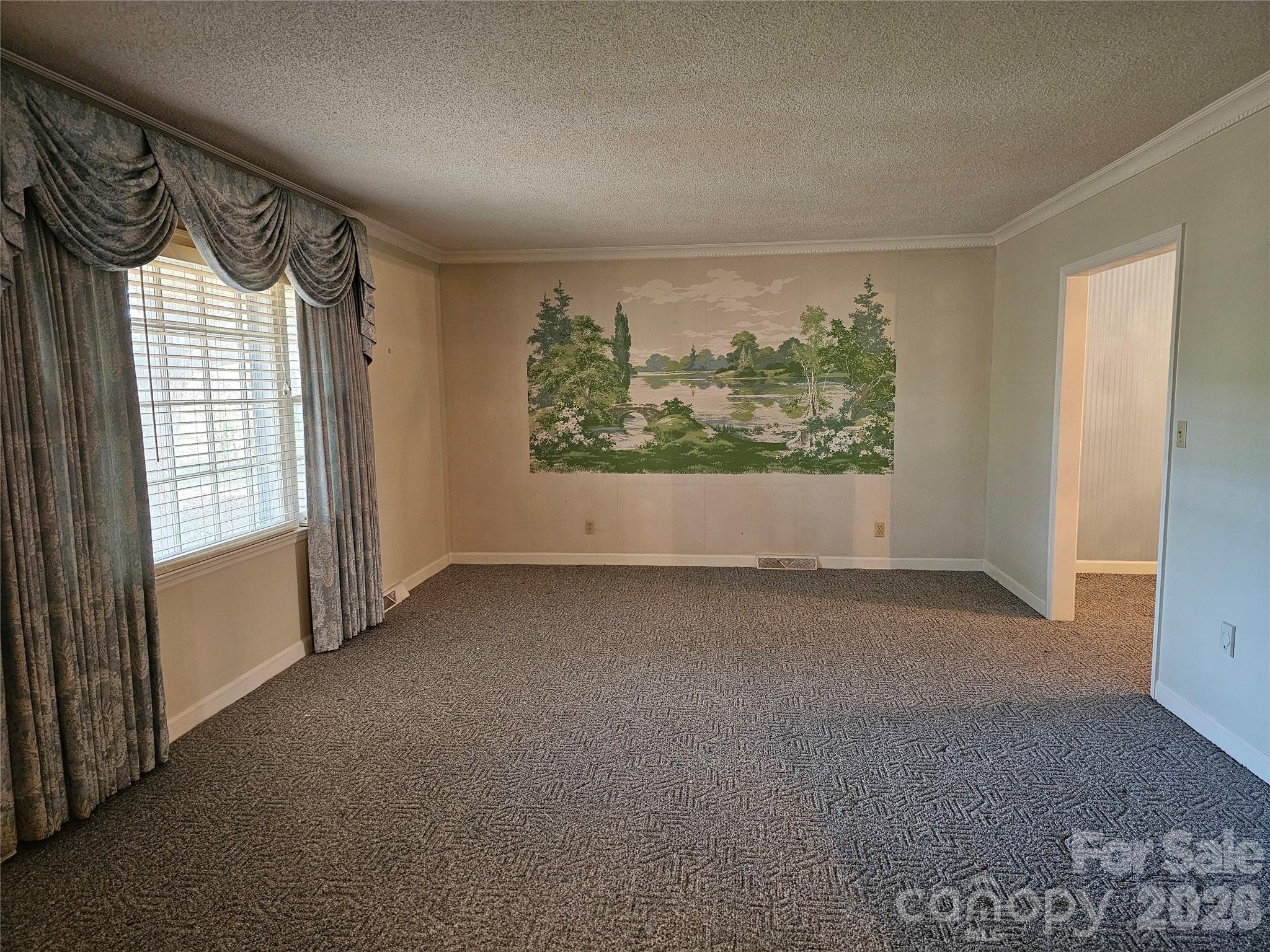 979 Suttle Road Lancaster, SC 29720 - Photo 5 of 26 an empty room with a large window