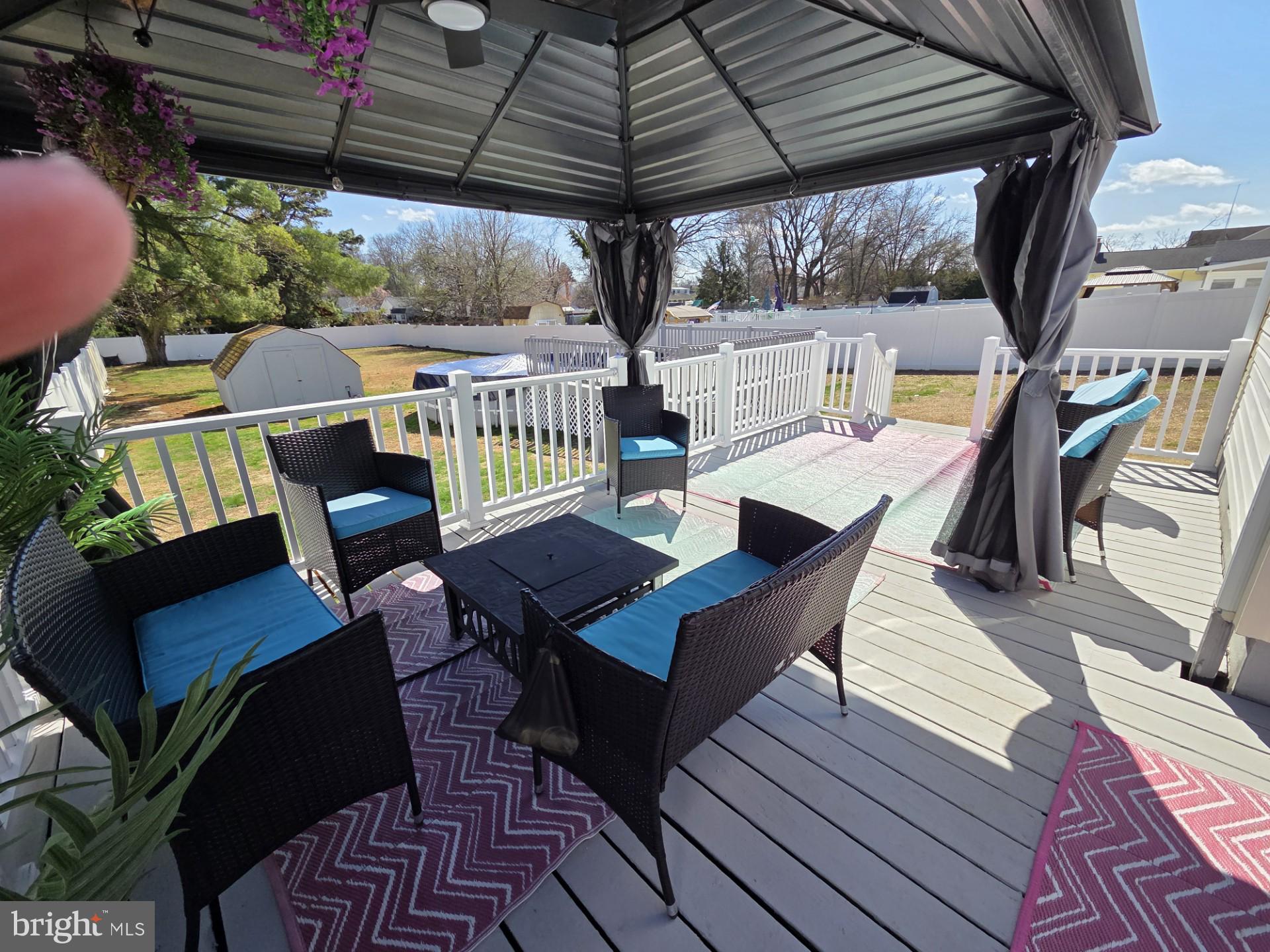 48 5th Avenue Maple Shade, NJ 08052 - Photo 7 of 31 a view of a chairs and table on the wooden roof deck