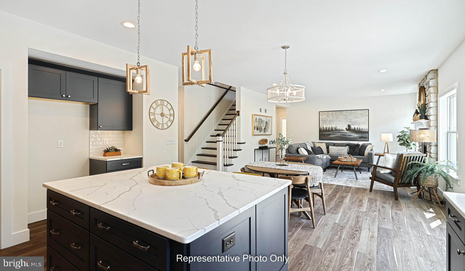 316 Goshawks Road Denver, PA 17517 - Photo 11 of 28 a view of a dining room with furniture a chandelier and wooden floor