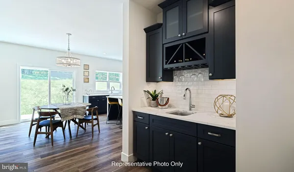 a kitchen with stainless steel appliances granite countertop a stove a sink dishwasher a microwave oven with granite countertops and cabinets