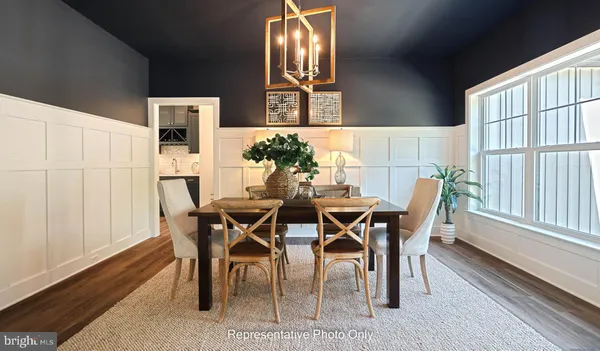 a view of a dining room with furniture and window