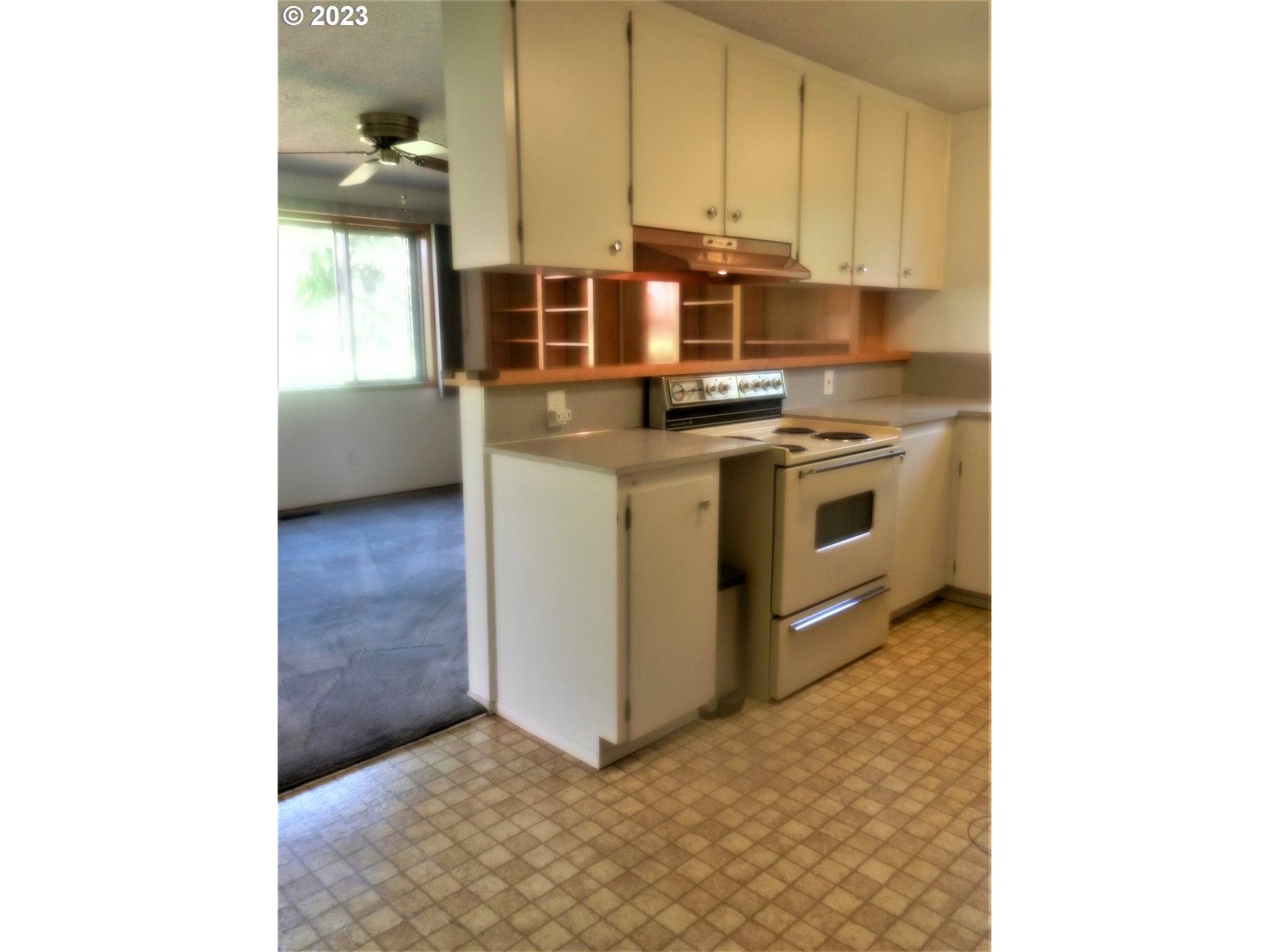1661 Princeton Road Woodburn, OR 97071 - Photo 11 of 28 a kitchen with stainless steel appliances granite countertop a stove a sink and a microwave
