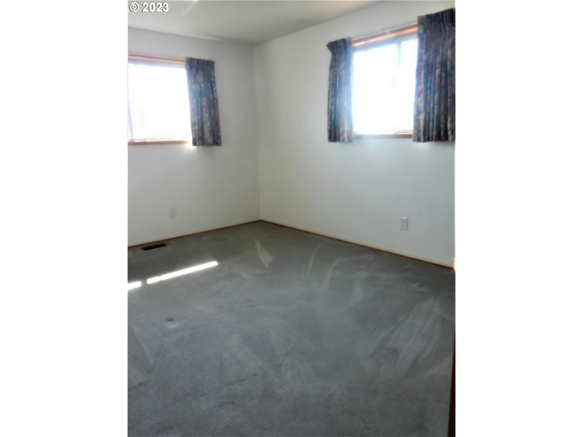 1661 Princeton Road Woodburn, OR 97071 - Photo 15 of 28 a view of an empty room with a window