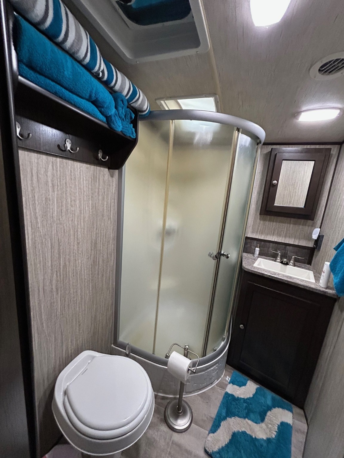 114 Red Snapper Drive Port Lavaca, TX 77979 - Photo 40 of 44 a bathroom with a toilet and a mirror