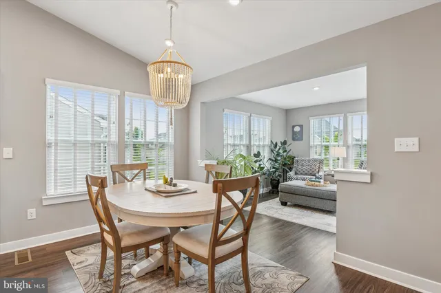 a dining room with furniture window wooden floor