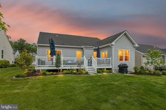 a front view of house with yard and outdoor seating
