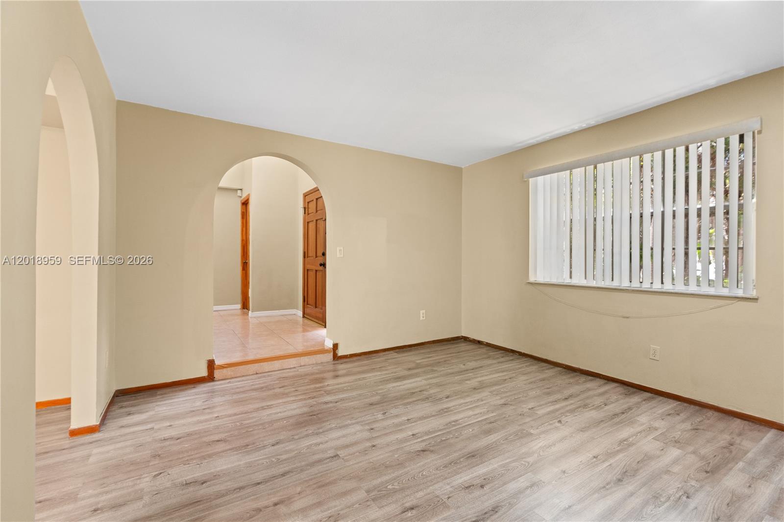 15345 Southwest 63rd Terrace Miami, FL 33193 - Photo 39 of 51 an empty room with wooden floor and windows