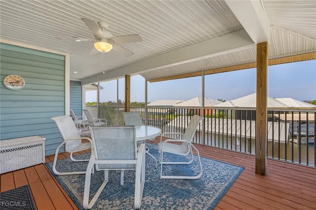 a view of a balcony with chair and wooden floor