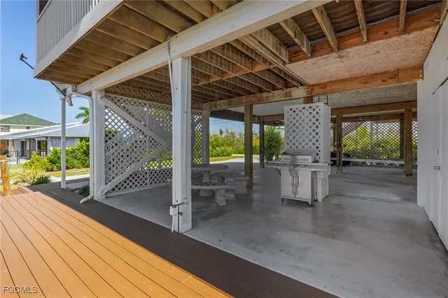 a view of a house with garden and a pond