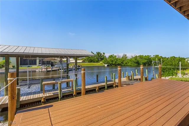 a balcony with dining table and chairs
