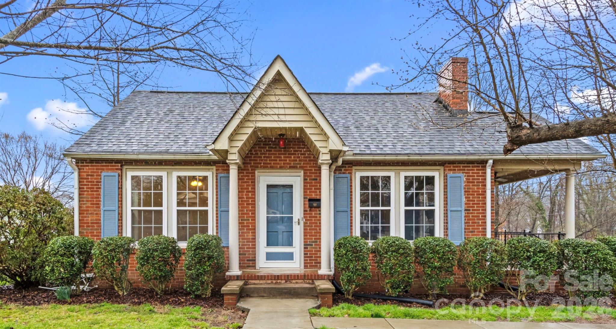 1409 Venus Street Kannapolis, NC 28083 - Photo 1 of 22 a front view of a house with garden