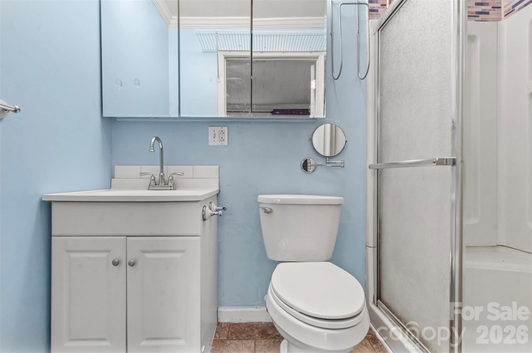 1409 Venus Street Kannapolis, NC 28083 - Photo 11 of 22 a bathroom with a toilet a sink and a shower