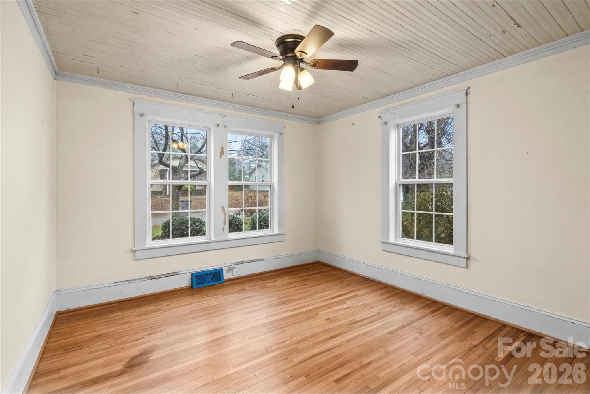 1409 Venus Street Kannapolis, NC 28083 - Photo 12 of 22 an empty room with wooden floor and windows