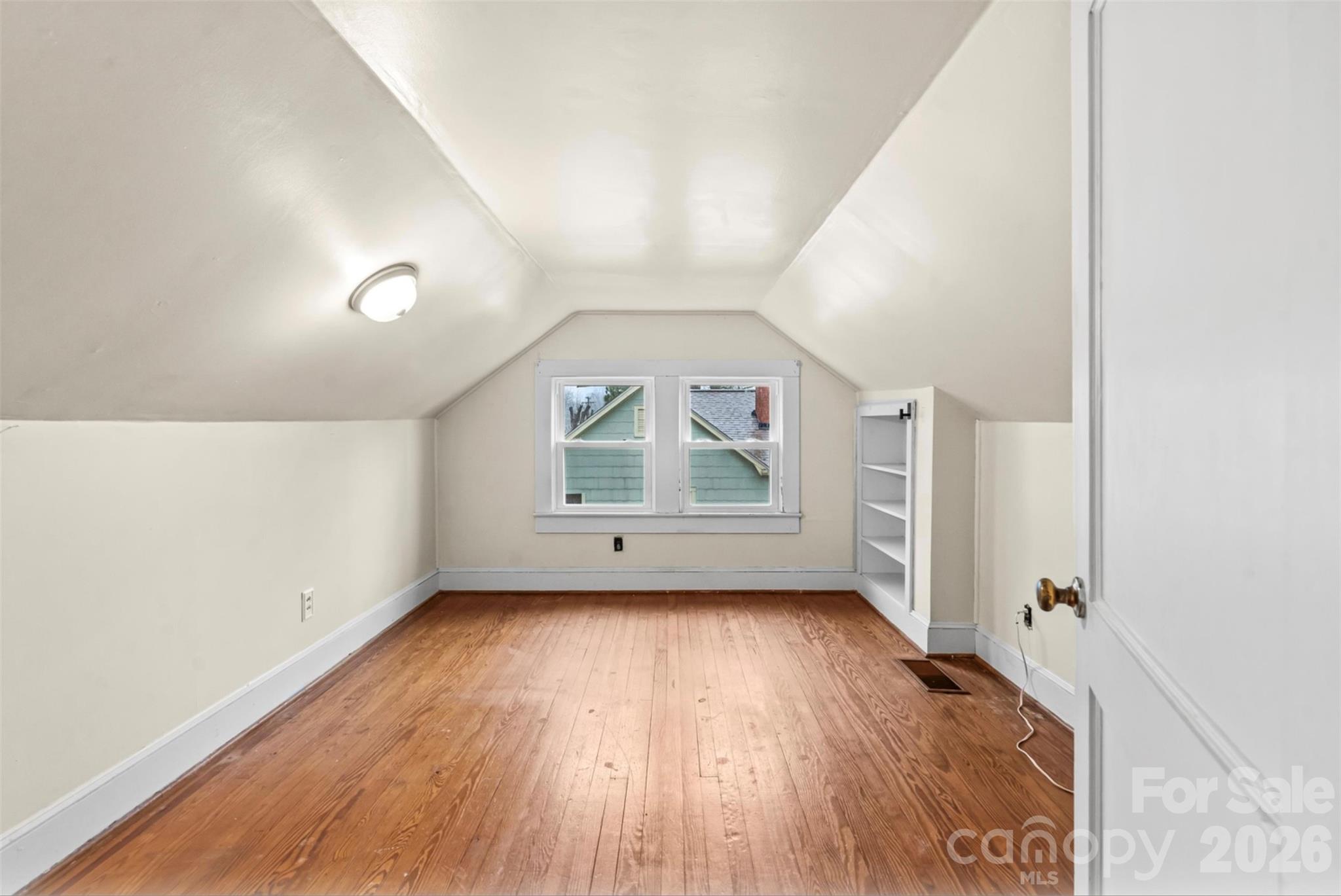 1409 Venus Street Kannapolis, NC 28083 - Photo 17 of 22 an empty room with wooden floor and windows