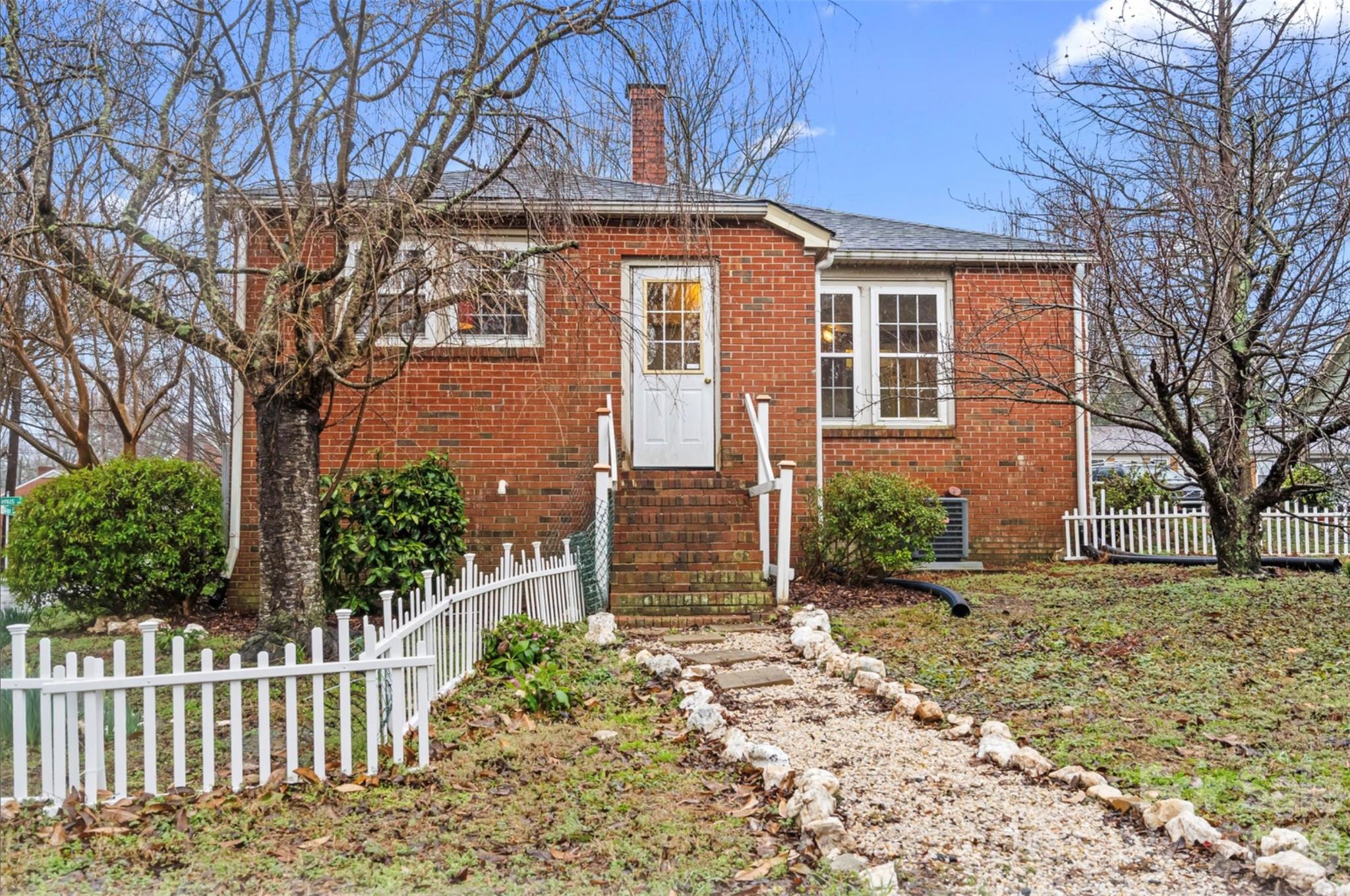 1409 Venus Street Kannapolis, NC 28083 - Photo 22 of 22 a front view of a house with a garden