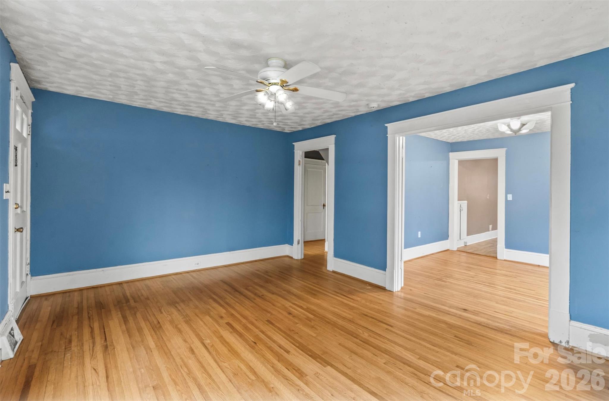 1409 Venus Street Kannapolis, NC 28083 - Photo 3 of 22 a view of an empty room with wooden floor