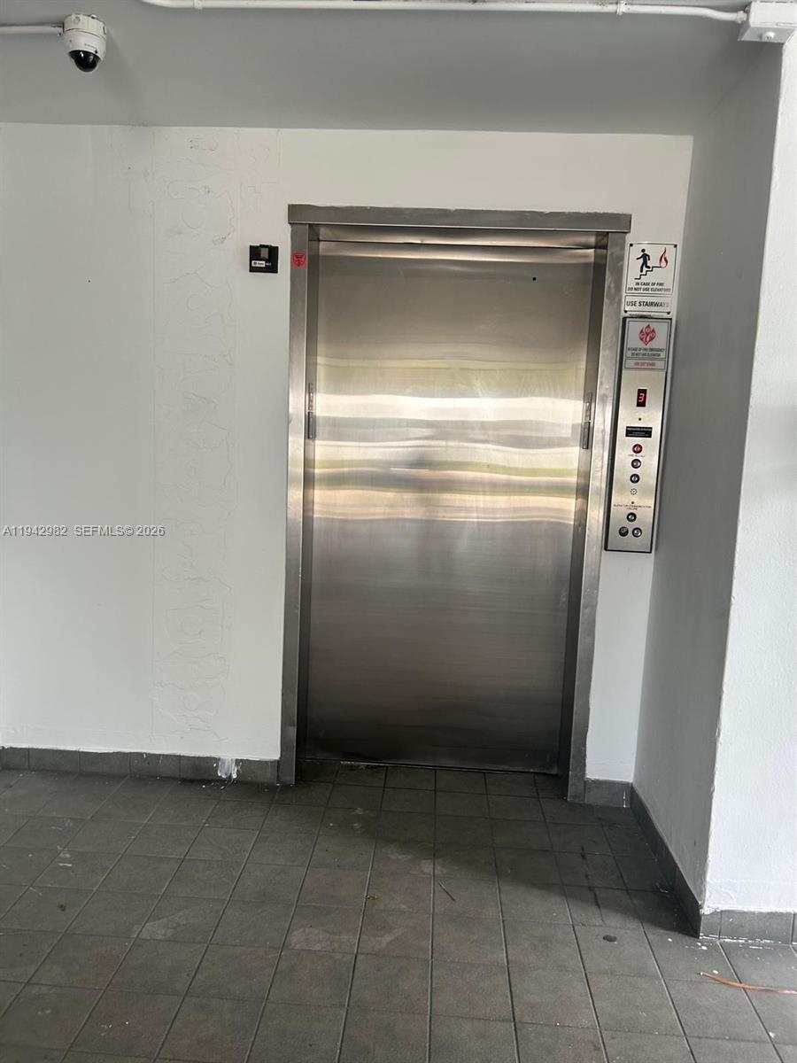 1150 Northeast 191st Street, Unit 45 Miami, FL 33179 - Photo 9 of 10 a view of a refrigerator in a kitchen