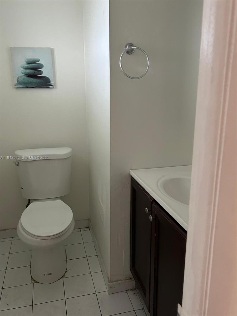 1150 Northeast 191st Street, Unit 45 Miami, FL 33179 - Photo 10 of 10 a bathroom with a toilet and a sink