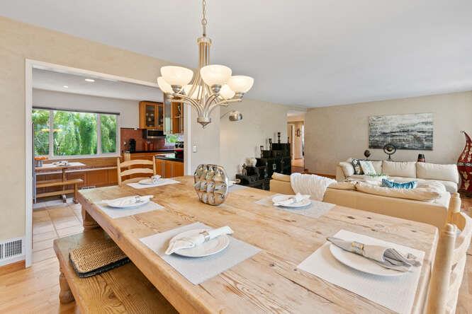 1159 Barcelona Drive Pacifica, CA 94044 - Photo 14 of 67 a view of a dining room with furniture a chandelier and large windows