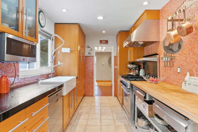 1159 Barcelona Drive Pacifica, CA 94044 - Photo 17 of 67 a kitchen with stainless steel appliances granite countertop a sink and a stove
