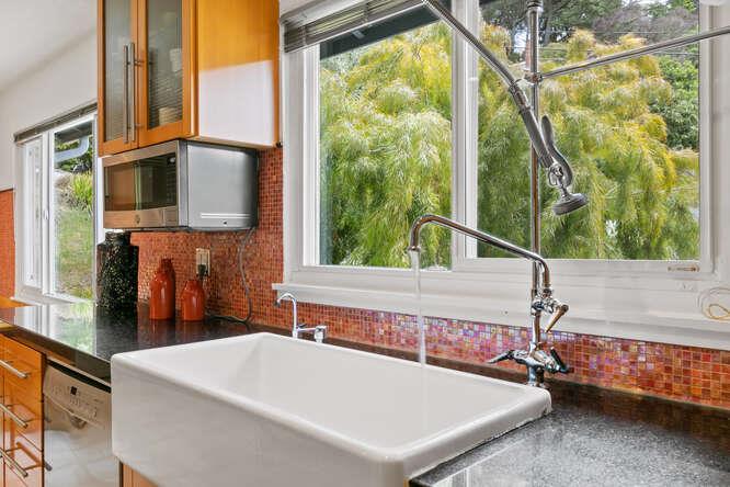 1159 Barcelona Drive Pacifica, CA 94044 - Photo 19 of 67 a white bath tub sitting in front of a building