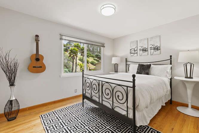 1159 Barcelona Drive Pacifica, CA 94044 - Photo 28 of 67 a bedroom with a bed and a window