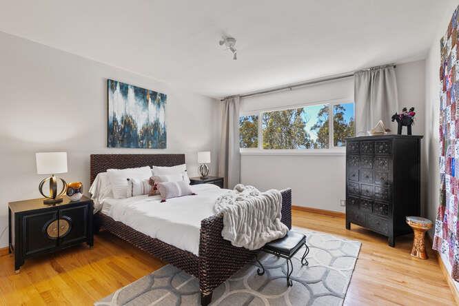 1159 Barcelona Drive Pacifica, CA 94044 - Photo 29 of 67 a bedroom with a bed and a window