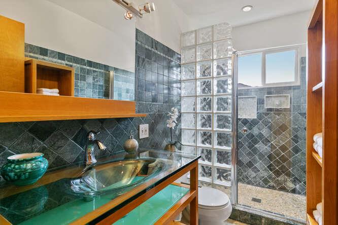 1159 Barcelona Drive Pacifica, CA 94044 - Photo 32 of 67 a bathroom with a granite countertop sink and a mirror
