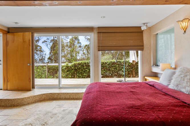 1159 Barcelona Drive Pacifica, CA 94044 - Photo 40 of 67 a large bed sitting in a bedroom next to a window