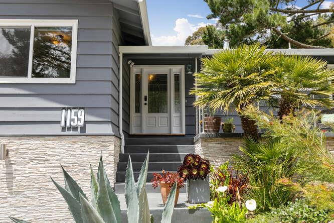1159 Barcelona Drive Pacifica, CA 94044 - Photo 5 of 67 a front view of a house with a yard