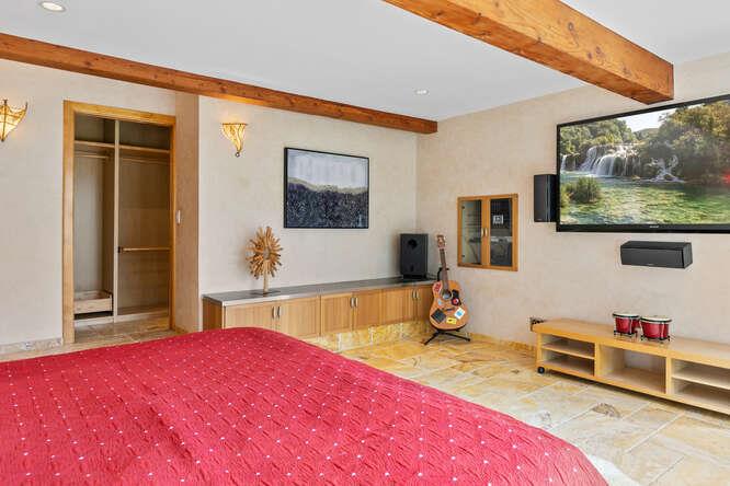 1159 Barcelona Drive Pacifica, CA 94044 - Photo 41 of 67 a bedroom with a bed and a flat screen tv