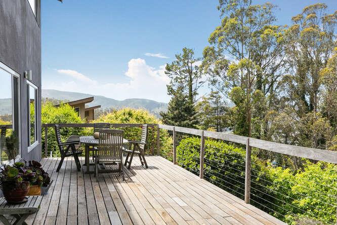 1159 Barcelona Drive Pacifica, CA 94044 - Photo 53 of 67 a view of a balcony with chairs and wooden floor