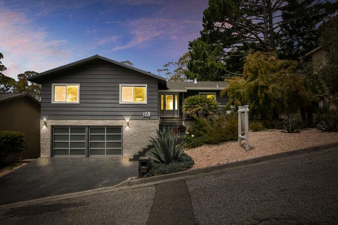 1159 Barcelona Drive Pacifica, CA 94044 - Photo 67 of 67 a front view of a house with a yard and garage