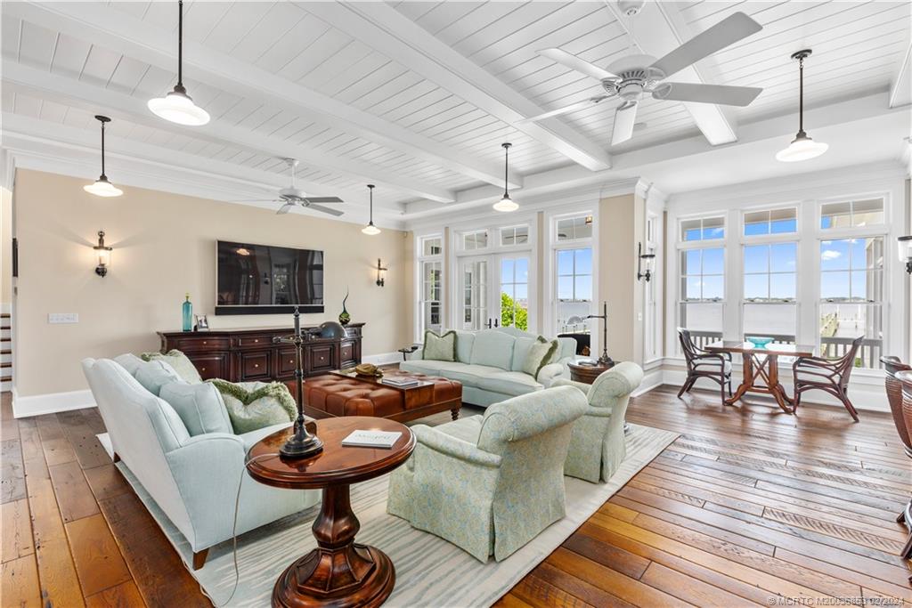 1441 Southeast Riverside Drive Stuart, FL 34996 - Photo 12 of 73 a living room with furniture and a flat screen tv