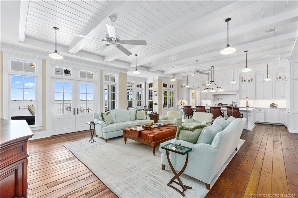 1441 Southeast Riverside Drive Stuart, FL 34996 - Photo 13 of 73 a living room with furniture and wooden floor