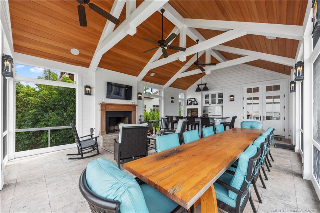 1441 Southeast Riverside Drive Stuart, FL 34996 - Photo 18 of 73 a view of a dining room with furniture window and outside view