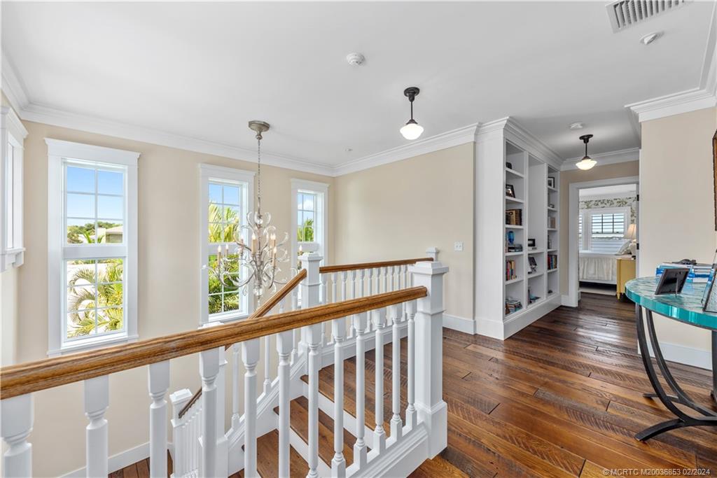 1441 Southeast Riverside Drive Stuart, FL 34996 - Photo 32 of 73 a view of hallway with wooden floor and windows