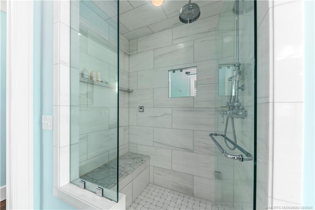 1441 Southeast Riverside Drive Stuart, FL 34996 - Photo 38 of 73 a bathroom with a shower