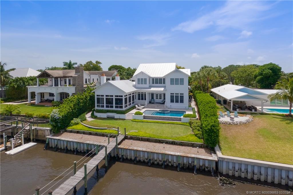 1441 Southeast Riverside Drive Stuart, FL 34996 - Photo 54 of 73 an aerial view of a house with swimming pool and ocean view