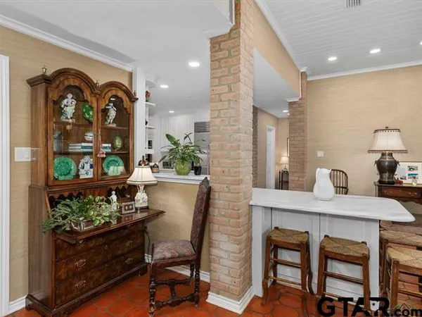 a dining room with furniture and window