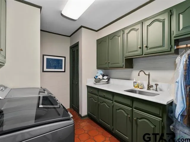 a kitchen with stainless steel appliances a sink and cabinets