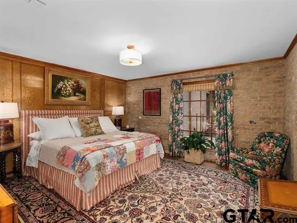 a bedroom with a bed and a couch