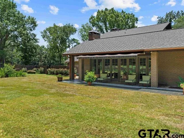 a view of swimming pool with patio